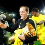 FILE PHOTO: Borussia Dortmund coach Thomas Tuchel celebrates winning the DFB-Pokal Final with the trophy